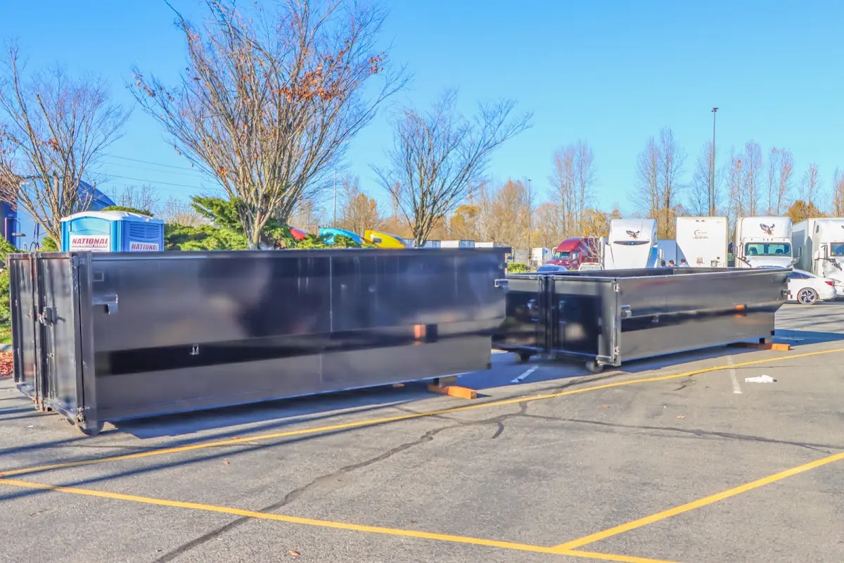 Professional dumpster rental service with roll-off container on residential driveway in Oro Valley